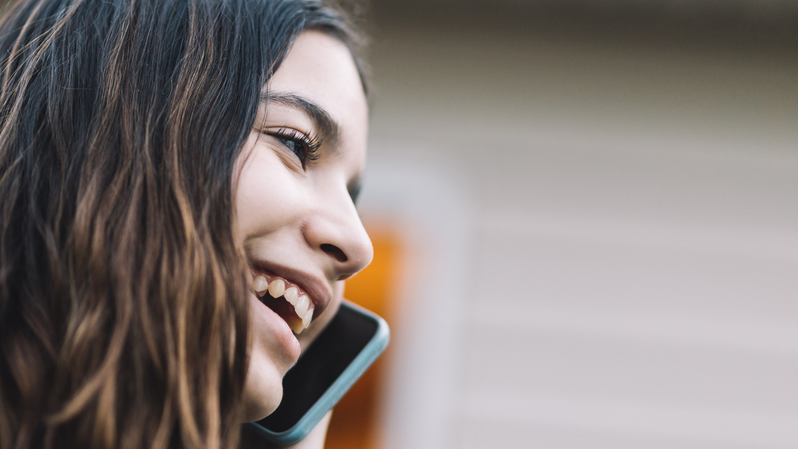 teenager smiling on the phone