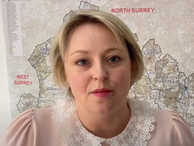 Police and Crime Commissioner Lisa Townsend in front of a map of Surrey