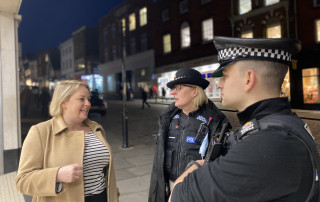 Police and Crime Commissioner Lisa Townsend with local police officers in town centre at night