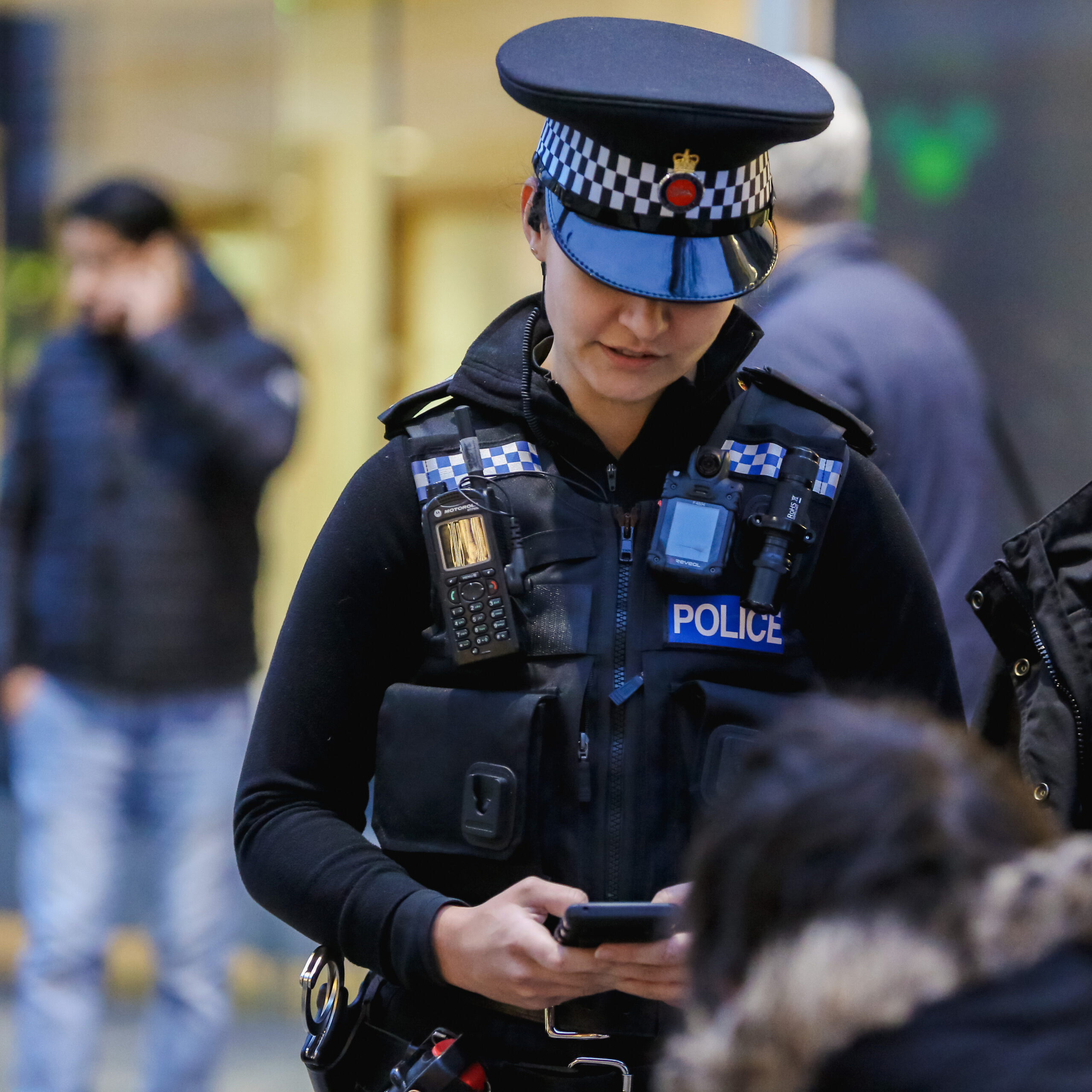 female police officer checking device
