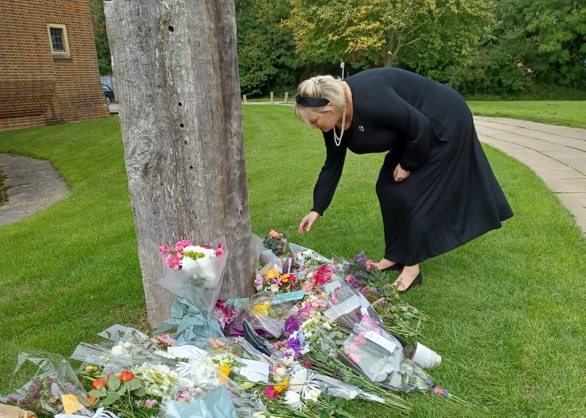 Police and Crime Commissioner Lisa Townsend lays flowers at service for Her Majesty HRH Queen Elizabeth II