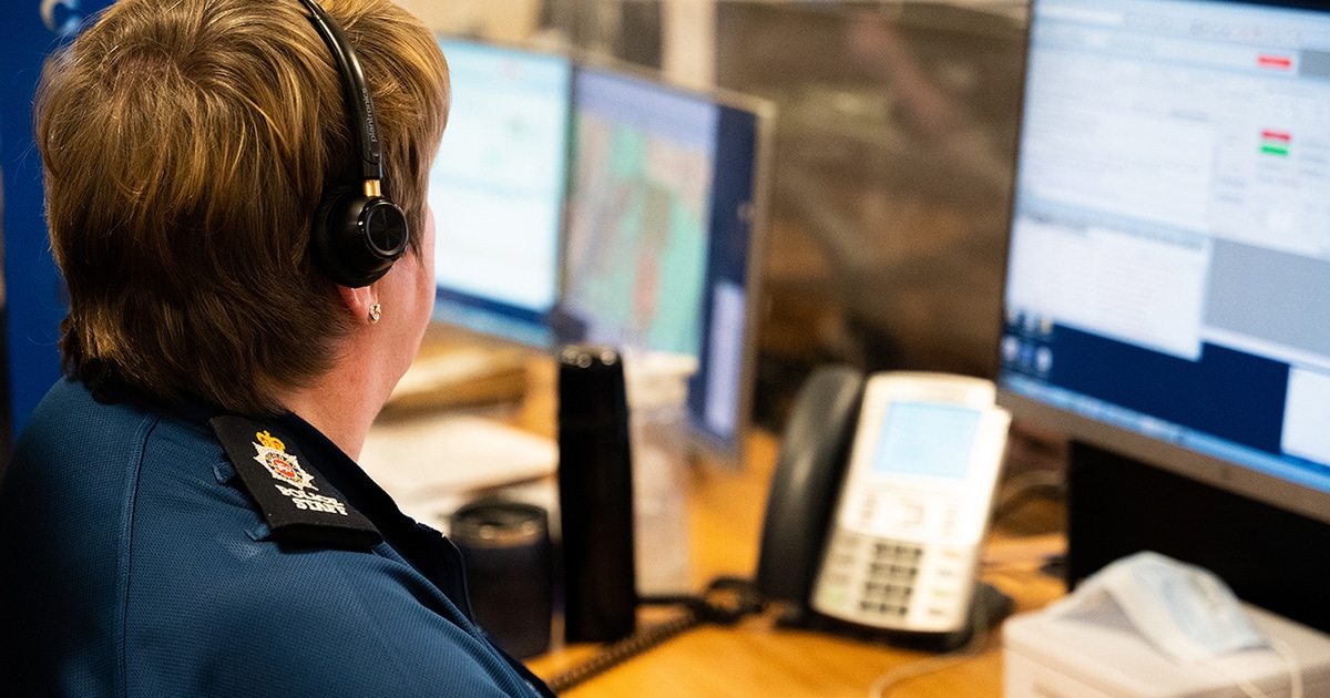 Surrey Police contact staff member at desk