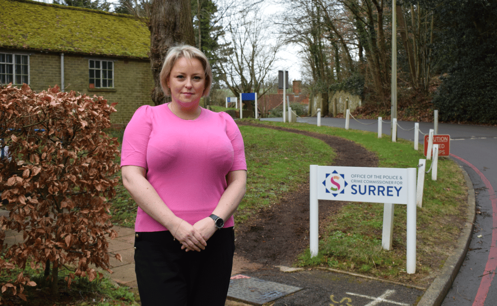 Police and Crime Commissioner Lisa Townsend stands outside in front of sign with office logo