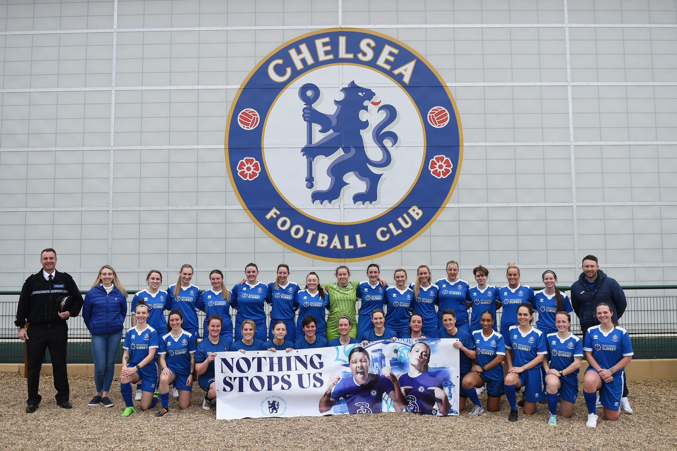 Deputy Police and Crime Commissioner Ellie Vesey-Thompson with police officers and children in football kit at the Chelsea Football club