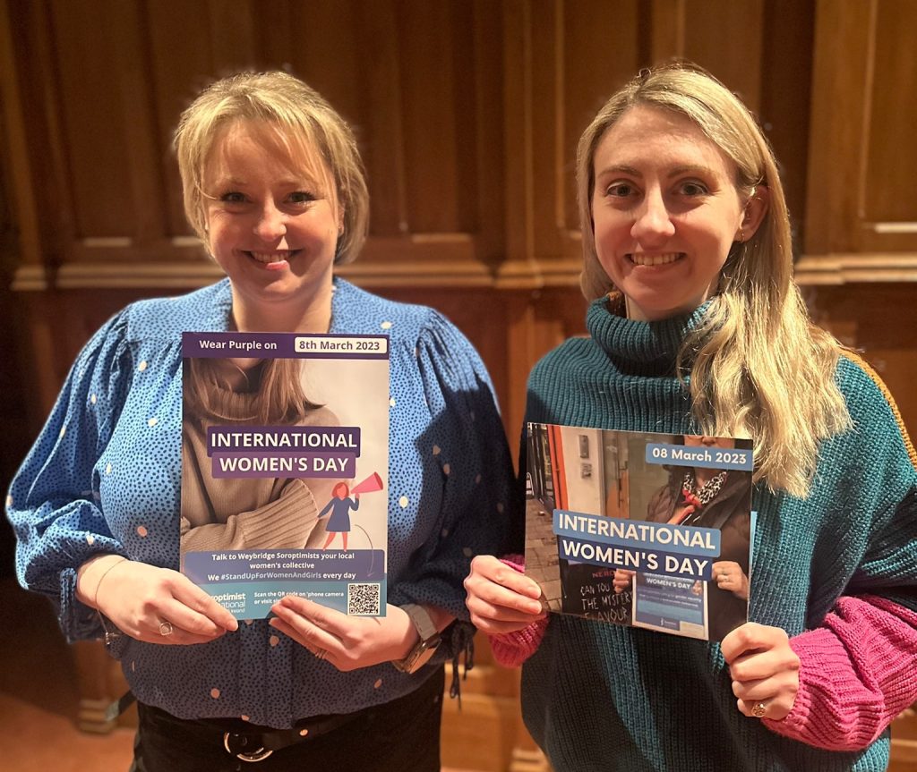 Police and Crime Commissioner Lisa Townsend and Deputy Commissioner Ellie Vesey-Thompson holding International Women's Day awareness materials