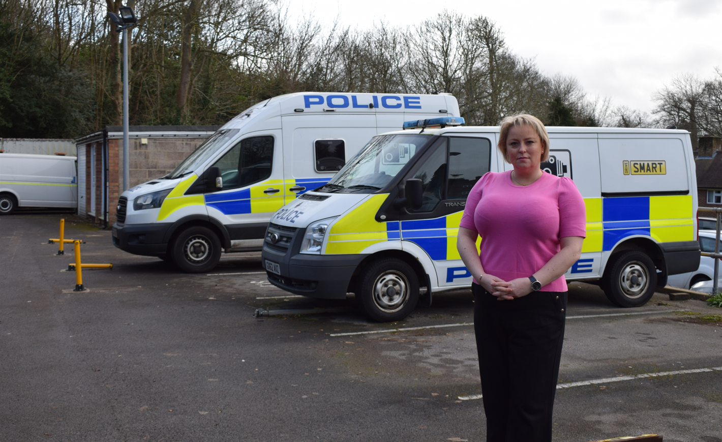 Police and Crime Commissioner Lisa Townsend standing in front of police vans