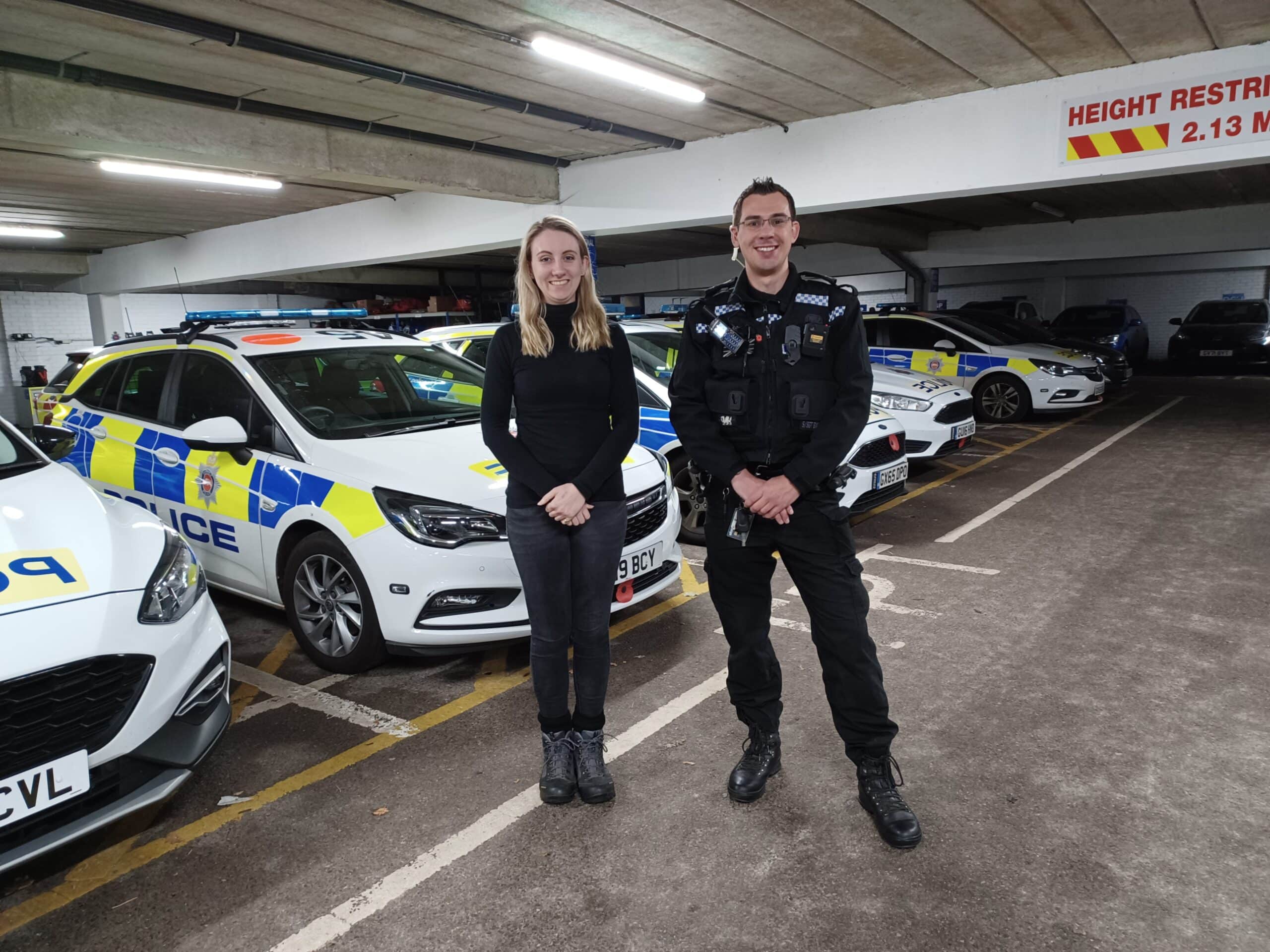 Deputy Police and Crime Commissioner Ellie Vesey-Thompson standing in front of police cars with a special police officer