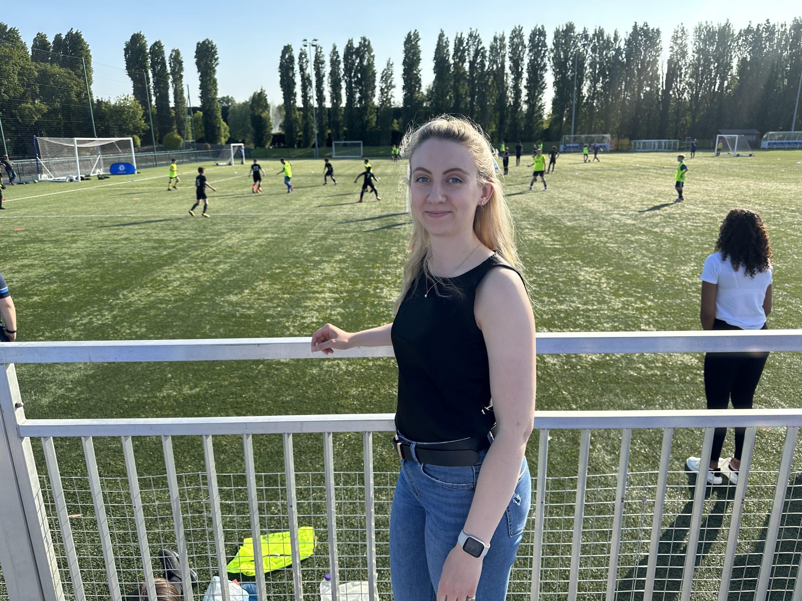 Deputy Police and Crime Commissioner Ellie Vesey-Thompson next to football pitch