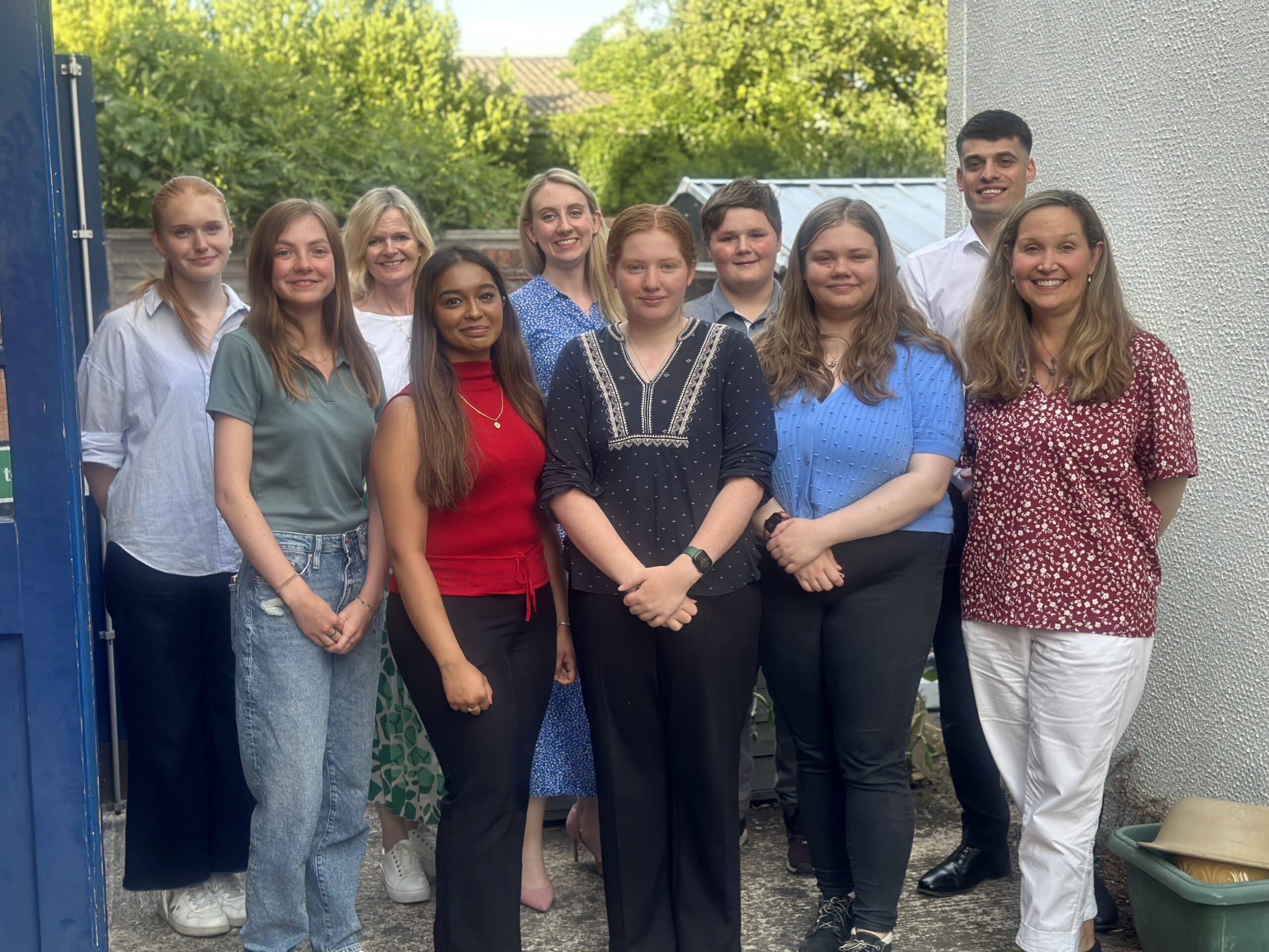 Deputy Police and Crime Commissioner Ellie Vesey-Thompson centre stands with Surrey Youth Commission members at the first ever Big Conversation Conference