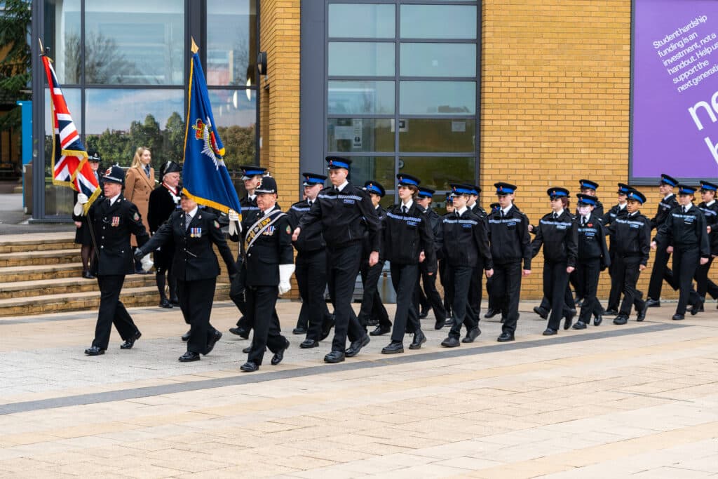 Deputy Police and Crime Commissioner for Surrey Ellie Vesey-Thompson watches a parade of Surrey Police Cadets in smart uniform and hats